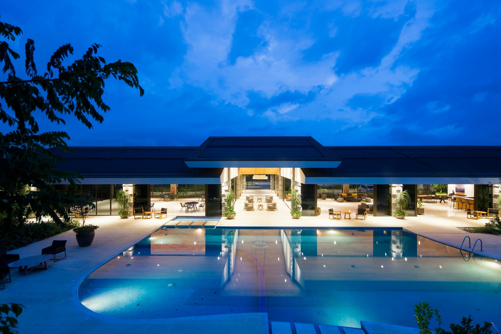 Resort pool and entrance at dusk